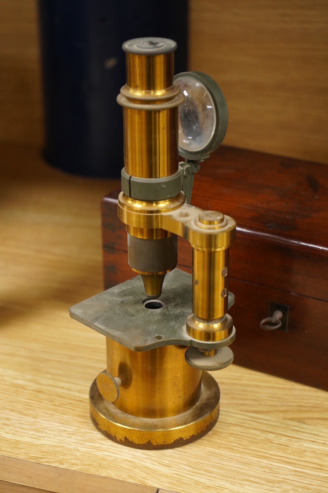 A mid 19th century French brass compound monocular microscope, by G. Oberhaeuser & E. Hartnack, Place Dauphine, Paris, number 2953, with an additional eyepiece, an objective and small box of slides, mahogany case 25.5cm